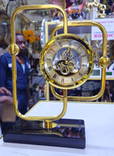 Gold Brass Skeleton Desktop Clock with Black Marble Base and Roman Numeral Dial — WIMU Kitchen Nairobi — Kenya · WIMU Kitchen