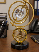 Gold Skeleton Table Clock with Crystal Sphere Armillary and Marble Base — WIMU Kitchen Nairobi — Kenya · WIMU Kitchen