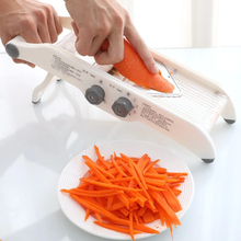 Multi-functional stainless steel grater and slicer – side view — Kenya · WIMU Kitchen